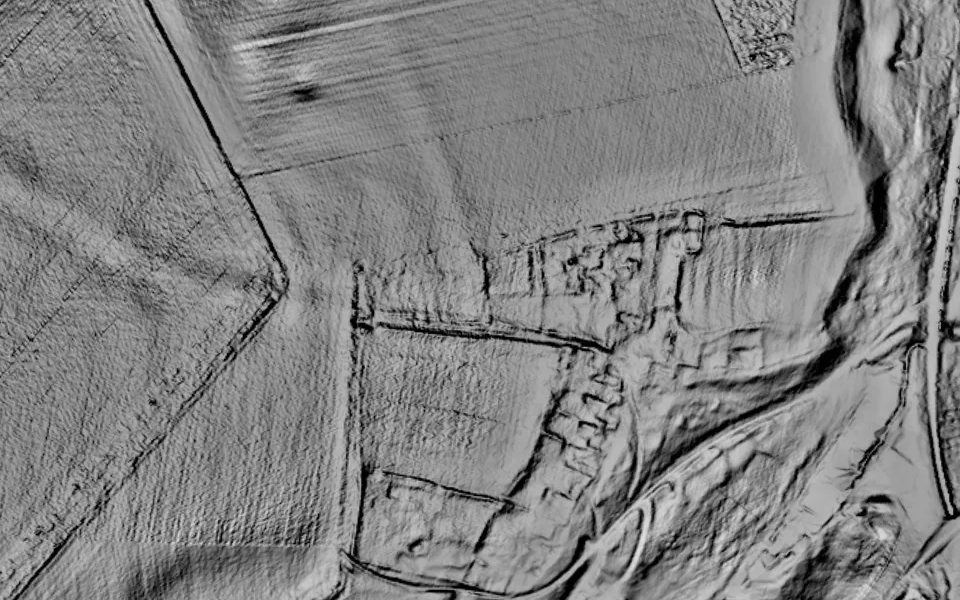 LiDAR terrain shading of Wharram Percy in North Yorkshire: rectangular earthwork plots along the edge of a valley.