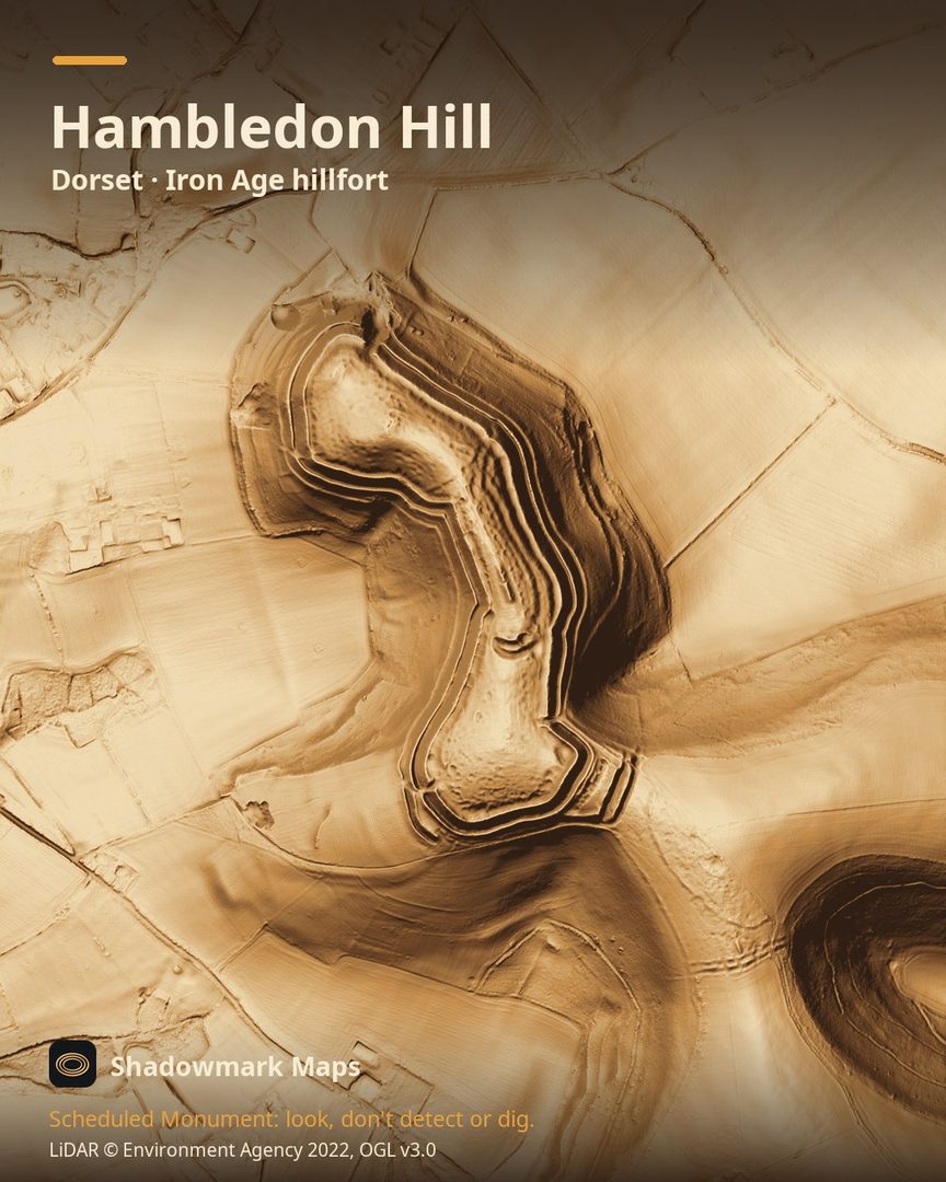 LiDAR terrain shading of Hambledon Hill, Dorset. Look for the hillfort's three ramparts on the main hill, the footprints of roundhouses inside, and the long mound of the barrow.